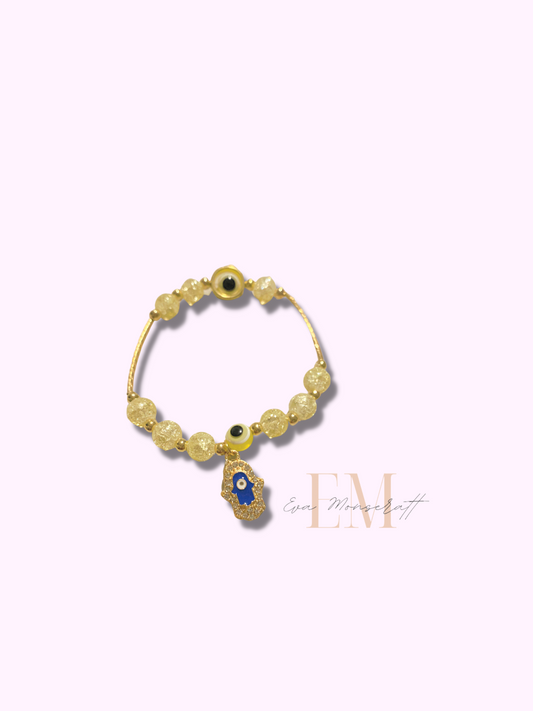 Yellow beaded gold tone evil eye